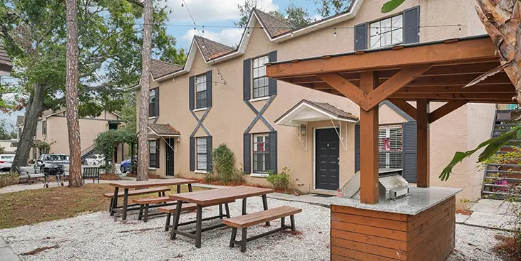 A yard with a bench swing