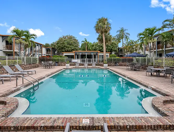 view of the pool with lounge chairs